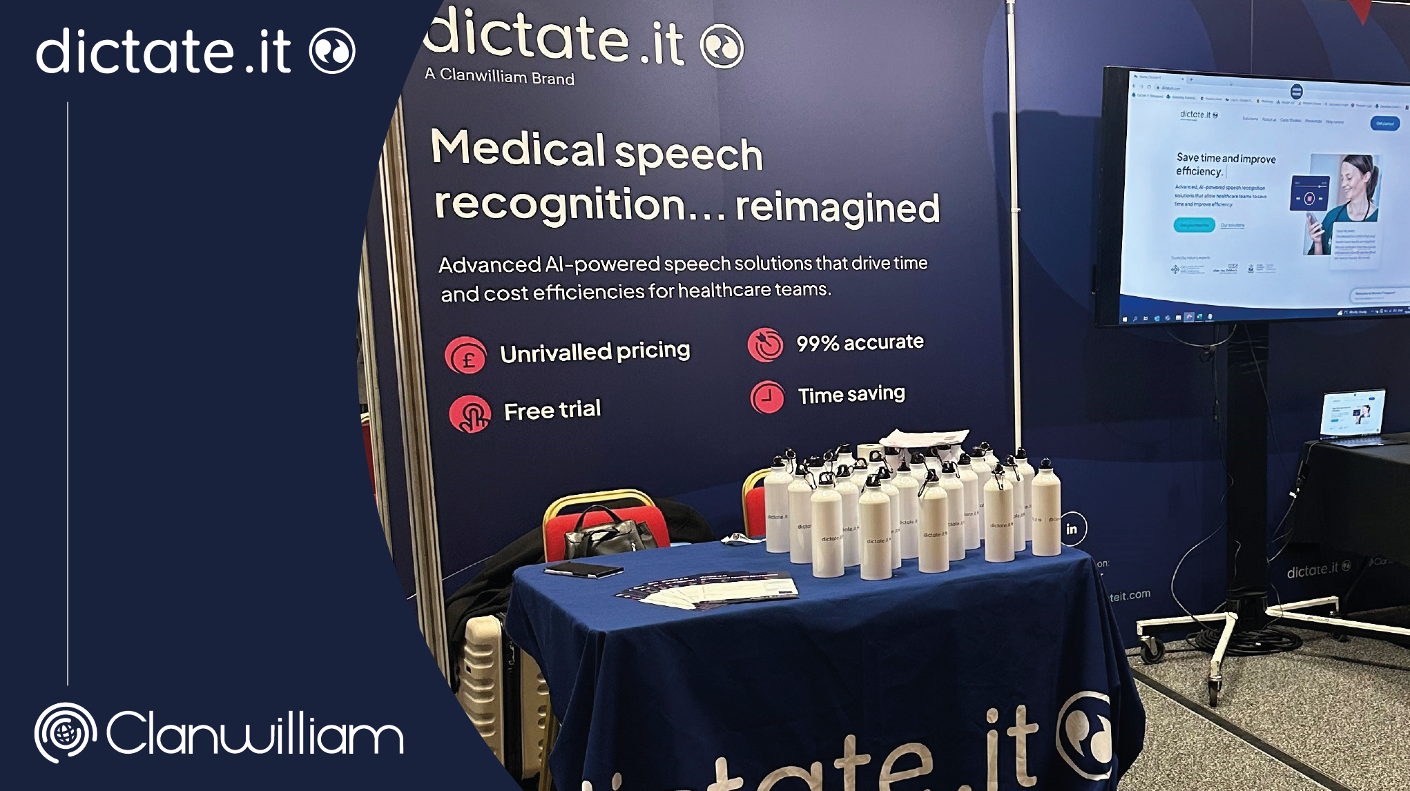 Dictate.IT's stand at P4H Scotland, featuring a branded tablecloth in blue, a large TV screen and navy blue and pink graphics